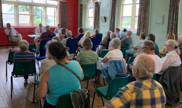 Geoffrey speaks to residents alongside local cllrs