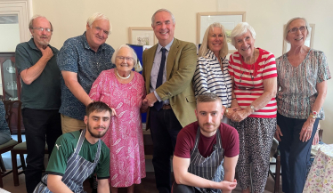 Geoffrey at the Drake Lodge with Residents and Staff